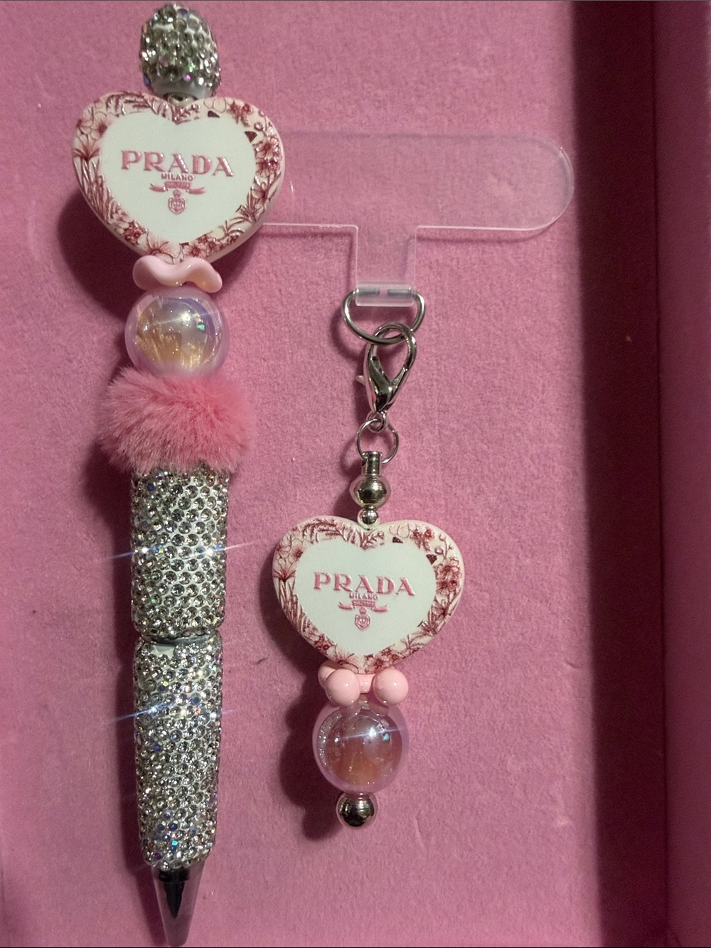 Silver and pink rhinestone pen with matching phone charm w/attachment.